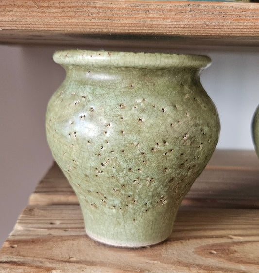 Small rustic green vase
